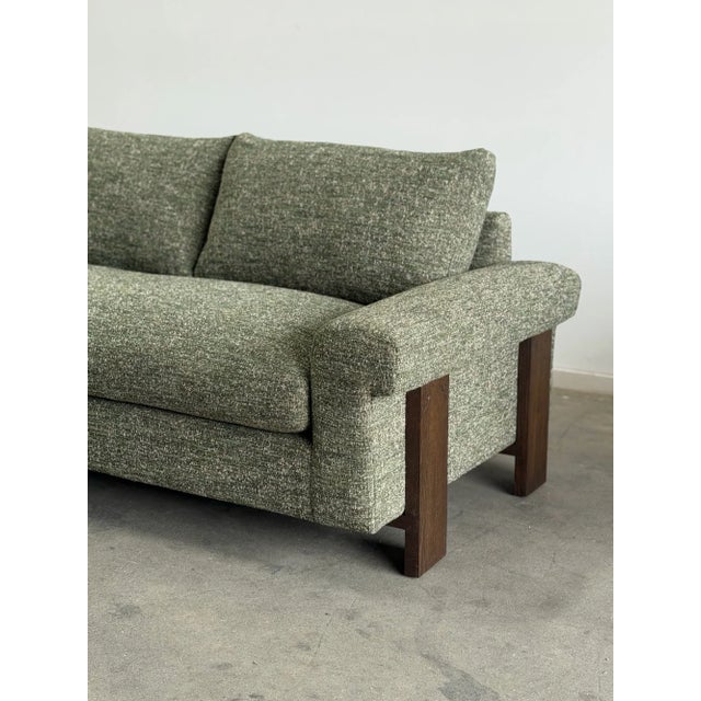 W100 D37 H31 (with pillow) Back H26 Arm H22 Seat W81 D23 H18 Our Scarpa features solid walnut exterior legs, a plush vegan...