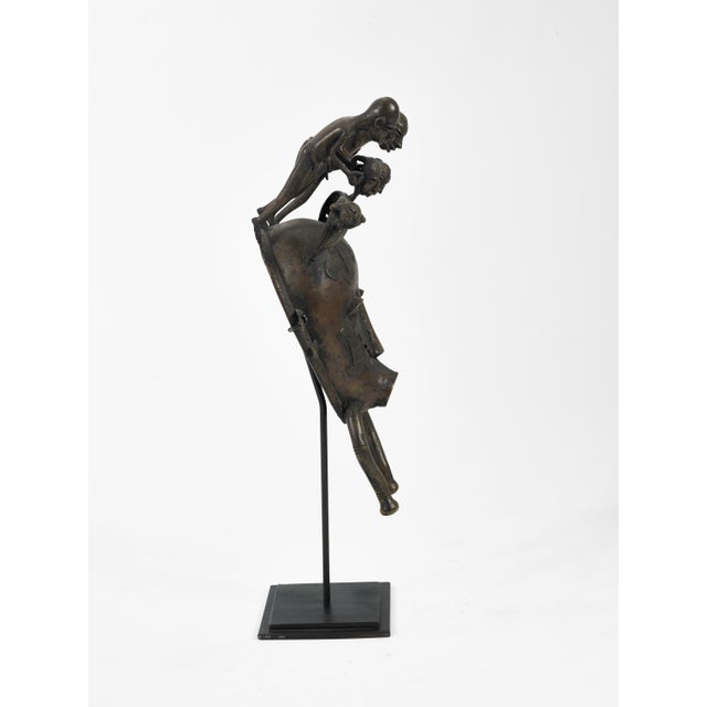 Tribal Ivory Coast Senufo Kpelie Cast Bronze Baul Mask Depicting Tribesmen on Stand For Sale - Image 3 of 4