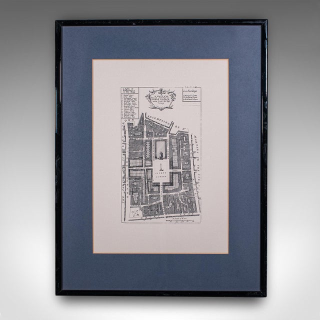 This is a vintage 18th century street map of London. An English, framed reproduction showing the parishes of St Clement's...