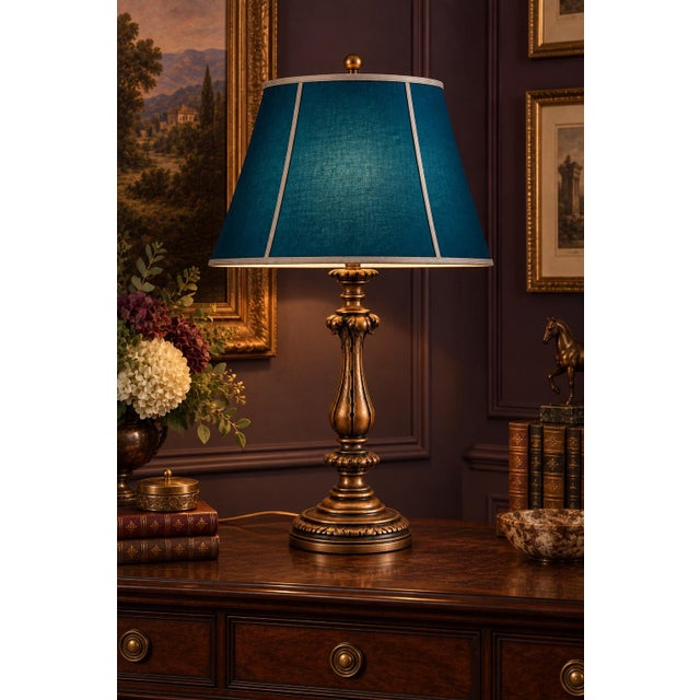 A dramatic vintage Neoclassical table lamp distinguished by its elongated fluted baluster body, sculptural acanthus-leaf...