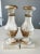 Elegant pair of vintage Italian-style candlesticks featuring classic urn-form silhouettes with distressed whitewashed...