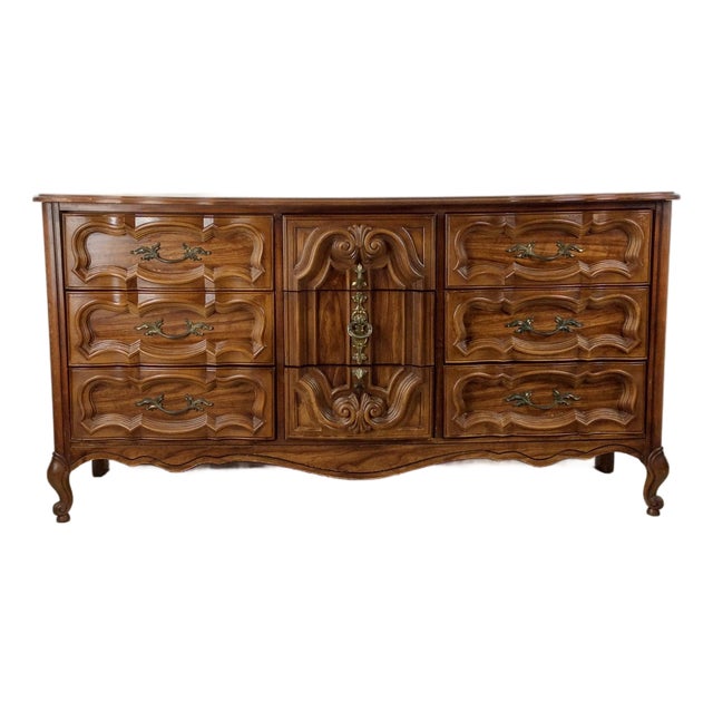 Mid Century French Provincial Style Lowboy Dresser With Ornate Drawer Faces For Sale