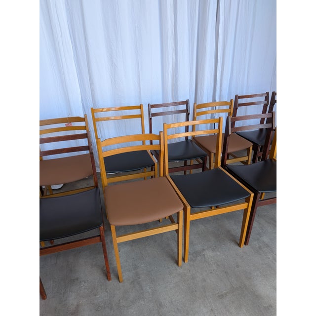 Set of 14 vintage dining chairs made by STOL Kamnik in Yugoslavia in the 1970s. This curated set combines three...