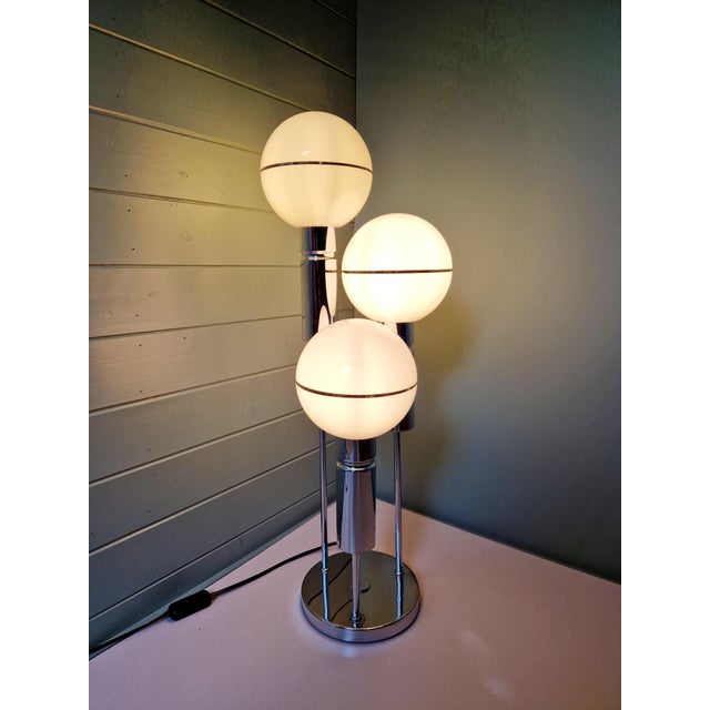 Large Space Age lamp in chromed metal with three white opaline glass globes, produced by the German manufacturer "Sölken...