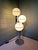 Large Space Age lamp in chromed metal with three white opaline glass globes, produced by the German manufacturer "Sölken...