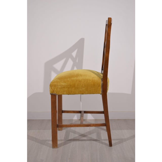 Set of six 1940s Italian chairs, featuring an elegant classic design with a geometric grid backrest, typical of period...