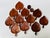 A striking mid-century Caribcraft serving set comprising 11 apple-shaped snack plates and two small cups, handmade in...