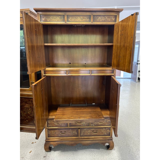 This vintage collectible item is a Drexel Heritage Dynasty Collection Chinoiserie armoire dresser, featuring high-polished...