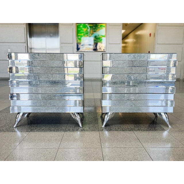 Pair of Italian mirrored chests of drawers or nightstands in the Hollywood Regency style, made in the 1980s. Structurally,...