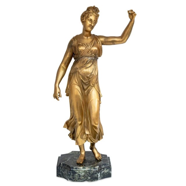 French Gilt Bronze Figural Sculpture, 19th century, depicting a classically draped standing female with raised arm, on a...