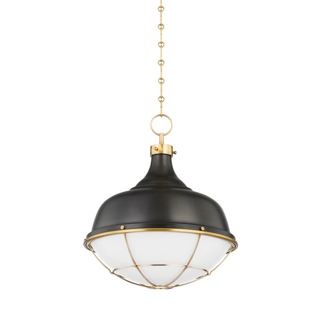 Gorgeous Aged Brass cagework and glossy opal glass give this recognizable silhouette an instant upgrade. The refined...