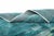 Where stone meets sea, captured in wool. This piece unfolds like a coastal horizon, a mottled field of odyssey grey, sage...