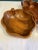 A beautiful set of three vintage monkey pod wood bowls featuring organic sculptural forms and richly figured grain. The...