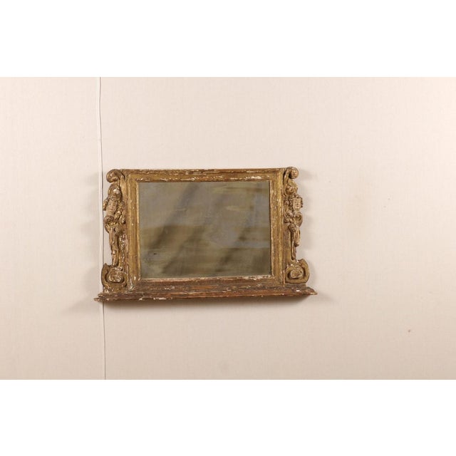 Italian horizontal carved wood mirror from the late 18th, early 19th century. The apparent simplicity of this rectangular...