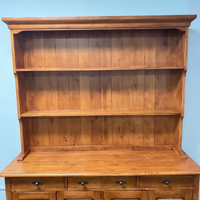 Two piece cabinet sideboard hutch. Beautiful wood. Has a plate channel for displaying your beautiful platters and plates....