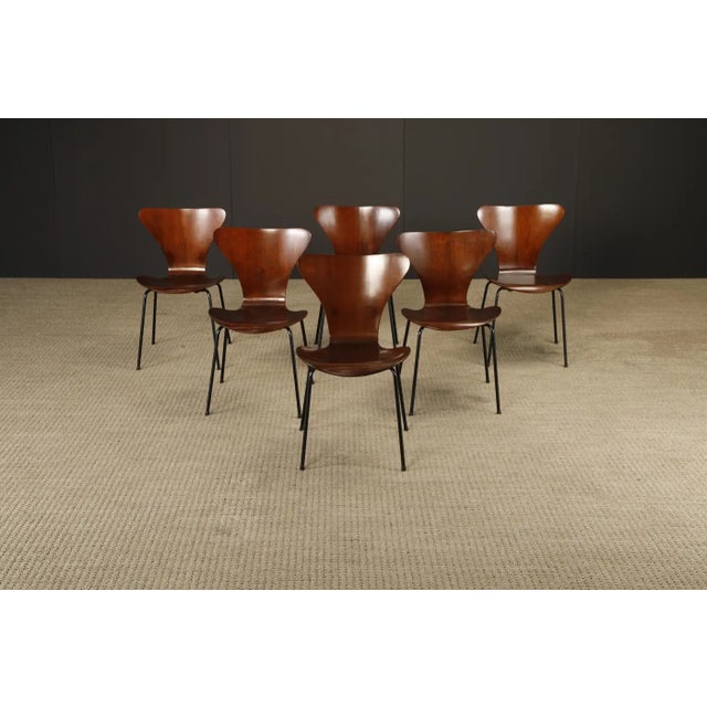 This exceptional set of 1960s Jacaranda rosewood 'Series-7' stacking chairs by Arne Jacobsen represents a rare and...