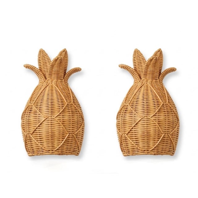 Bring a touch of classic coastal elegance and warm texture into your space with this charming pair of vintage woven rattan...