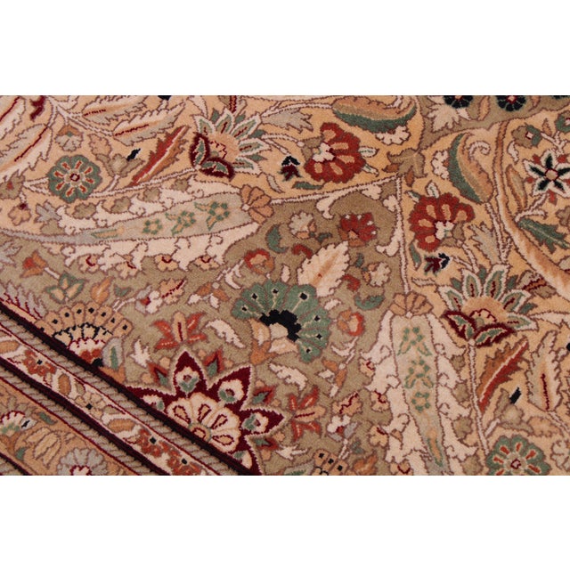 Designed with mesmerizing intricacy and gorgeous color palette, this hand-knotted masterpiece demonstrates the beauty and...