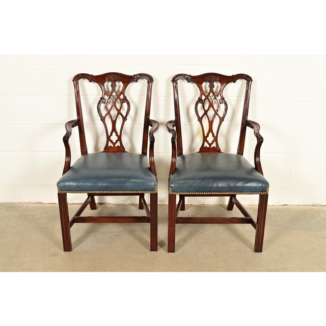 A gorgeous pair of Georgian or Chippendale style armchairs or dining captain chairs By Councill Craftsmen USA, Circa 1980s...