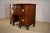 Early 19th century mahogany brand board, or small sideboard from England. This piece has a banded mahogany edge with...
