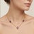 This exquisite necklace features a radiant pairing of deep violet Amethyst gemstones, prized for their royal brilliance...