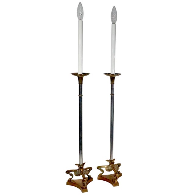 Chic pair of bright chrome, and cast brass table lamps, featuring triangular footed bases, elongated tubular chrome stems,...