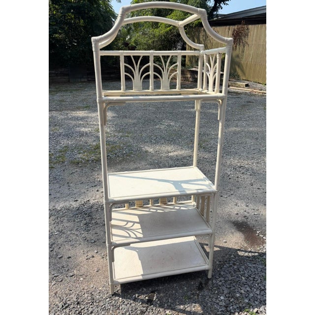 Etagere in an Ivory Bisque Color with deep shelves. Top Shelf has a Glass Insert. Gives ia rattan coastal vibe and a great...
