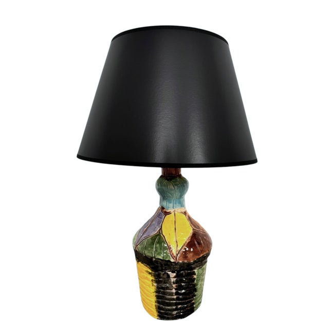 25"H x 8" Base Diameter Lampshade:16”Diameter x 10”H The Alchemist’s Vessel is a one-of-a-kind luminaire that breathes new...