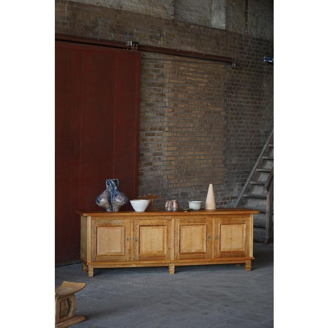 A beautifully crafted Danish sideboard in solid oak, featuring a restrained yet characterful design that highlights the...