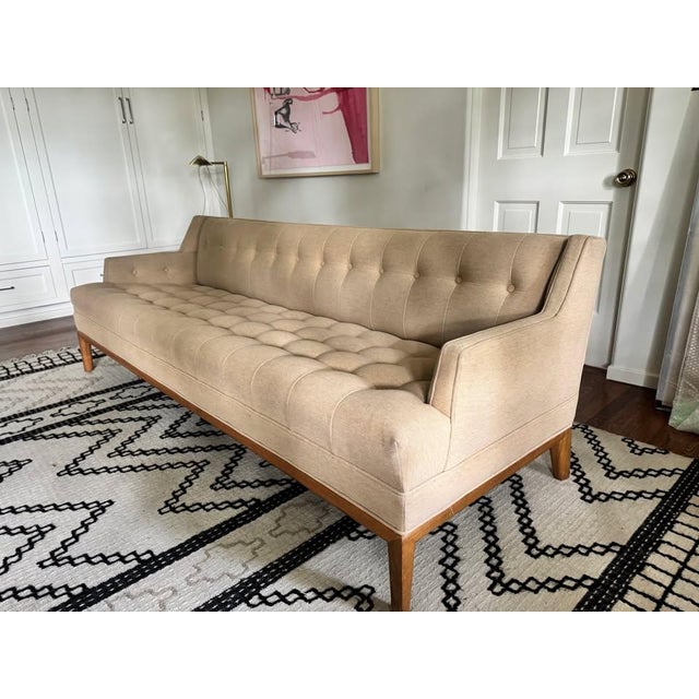 The Maurice Sofa is a midcentury inspired sofa with a tufted seat, back, and inner arms and piped details. The sofa rests...