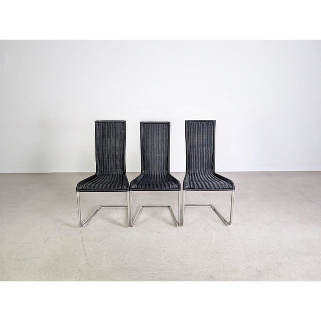 Beautiful set of three Tecta B20 cantilever chairs in a modern black finish for sale. Unfortunately, the wickerwork,...