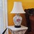 Vintage Chinoiserie floral porcelain table lamp featuring a hand-painted botanical design on an ivory-white vase-form...