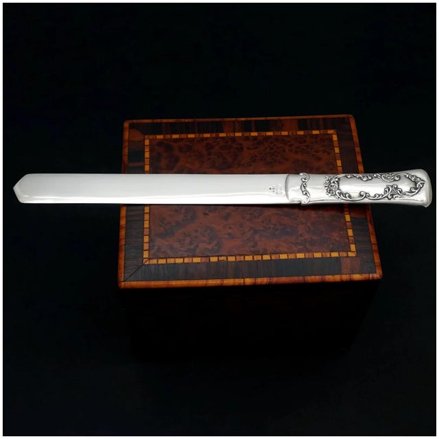 Antique Gorham sterling silver paper knife. The handle is decorated in relief with charming florals and foliage....