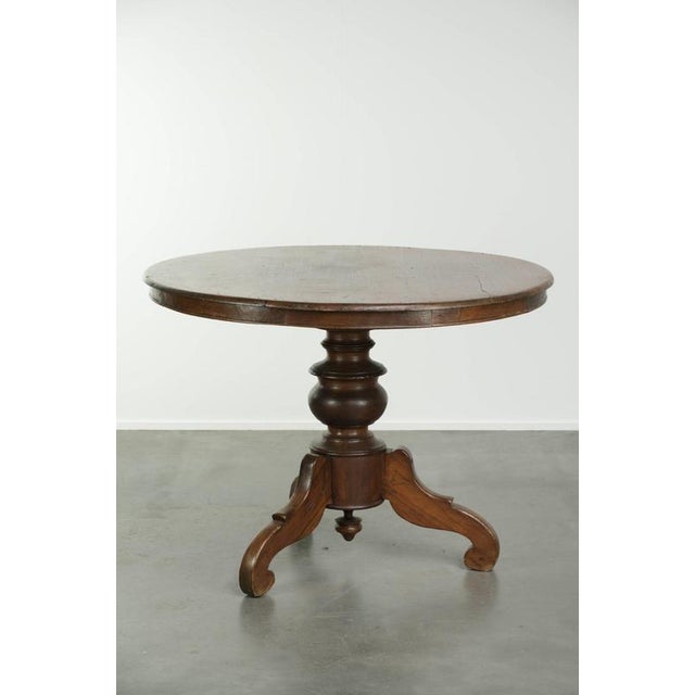 This beautiful, subtly rounded rustic wooden dining table features an elegant leg, a charming appearance, and a gorgeous...