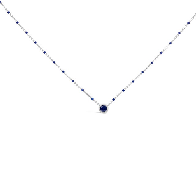 Crafted with the utmost precision, this enchanting necklace, shimmering in .925 sterling silver, elegantly carries lab-...