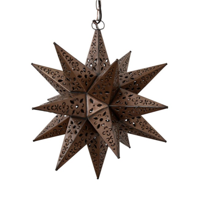 New special order item. Not vintage. Twinkling with rustic charm, this hand-crafted Tin Star Pendant light adds a playful...