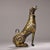 This is a cast bronze figurine of a seated dog, featuring extensive gold inlay (gilt bronze) decoration. The dog is...