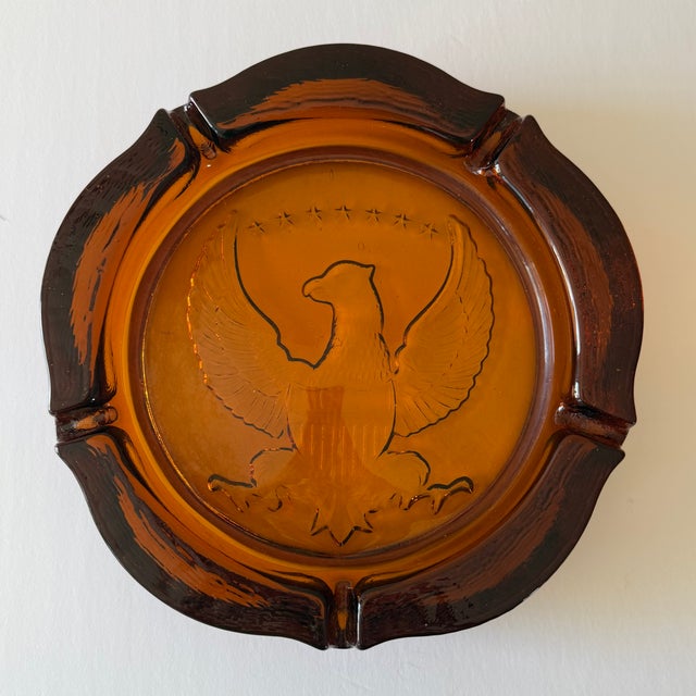 Heavy vintage Americana glass cigar ashtray with American eagle crest. Most items found at Pub & Oasis are vintage and...
