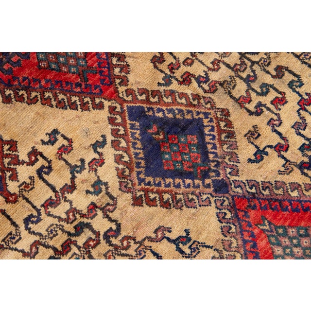 Beautiful Vintage Shiraz hand-knotted Wool rug with the navy blue field. This piece has a red frame and multicolor accents...