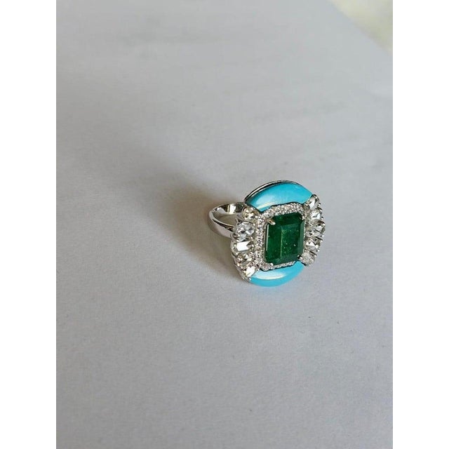 A very gorgeous and beautiful, modern style, Emerald & Turquoise Cocktail Ring set in 18K White Gold & natural Diamonds....