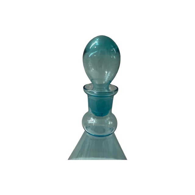 we have for your consideration a very beautiful mid century modern blue glass bottle with stopper. manufacture is unknown...