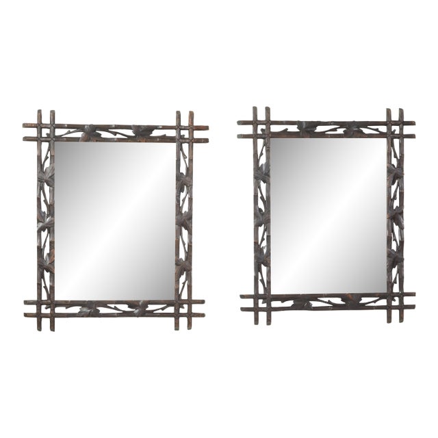 Black Forest 1900s Mirror with Carved Vine Motifs and Intersecting Corners For Sale
