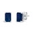 Immerse yourself in the timeless elegance of these stud earrings, each boasting a lustrous 6x4mm emerald-cut blue...
