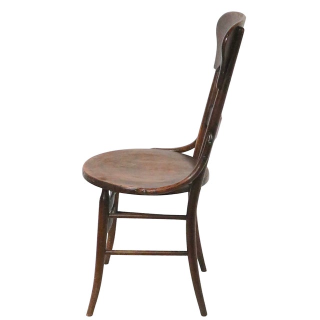 Stylish Turn of The Century oak side chair with sculptural solid oak backrests, and bentwood hip supports. This example is...