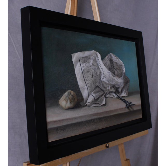 Realism Everyone's Favorite Game by Kelly Birkenruth | Oil on panel Still life with newspaper, rock, and scissors For Sale - Image 3 of 5