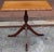 An antique English Mahogany Supper Table, likely dating to the Regency period around 1820s. It features a tripod base and...