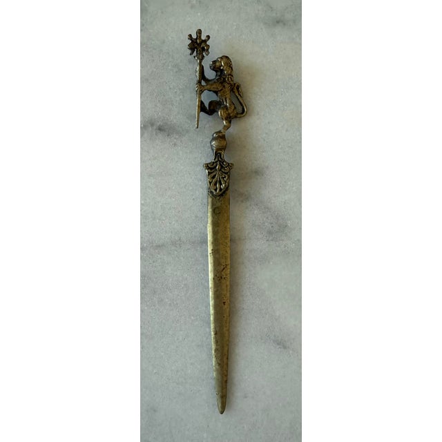 Vintage brass letter opener with a lion holding a staff is believed to be manufactured in Italy by Mantagnani. Wonderful...