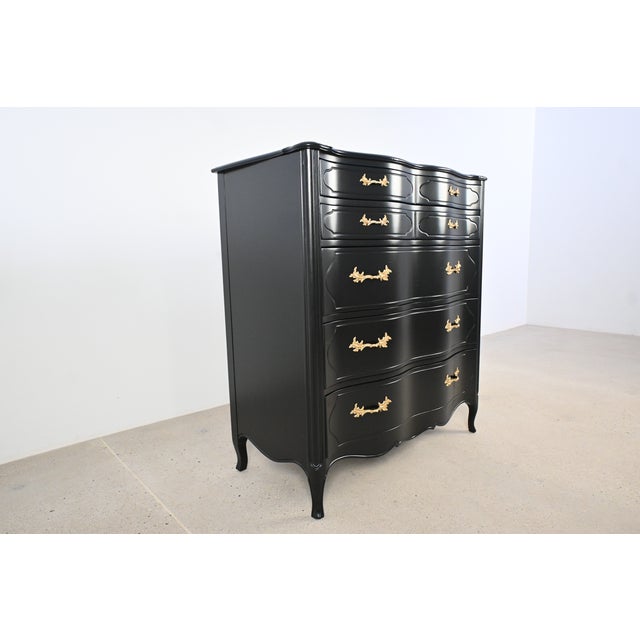 Elegant French Provincial chest of drawers by Tomlinson, newly refinished in a rich black lacquer for a sophisticated,...