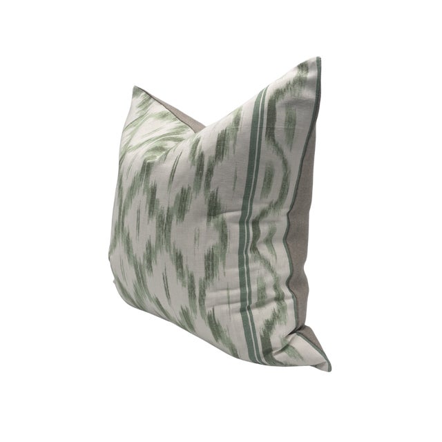 Pair of handcrafted pillows fashioned with Schumacher in Santa Monica Ikat green fabric on the front and backed in a flax...