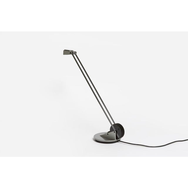 The lamp was produced in a small series by the Swiss manufacturer Belux. The angle of the lamp can be adjusted via the...